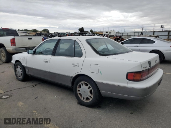 1994 Toyota Camry XLE with VIN JT2GK13E5R0008509, listed as a Copart auction lot 76014164 with 188,427 mi miles and Salvage Title. Bid and sale history available at carsss.com. Image 2.