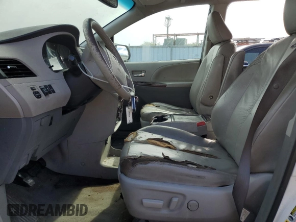 2012 Toyota Sienna XLE AAS with VIN 5TDYK3DC4CS231794, listed as a Copart auction lot 58206235 with 141,935 mi miles and Non repairable. Bid and sale history available at DreamBid. Image 7.