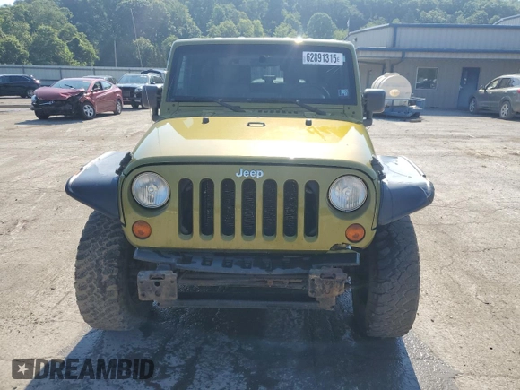 2010 Jeep Wrangler Sahara with VIN 1J4AA5D16AL203910, listed as a Copart auction lot 62891315 with 124,337 mi miles and Salvage title. Bid and sale history available at DreamBid. Image 5.
