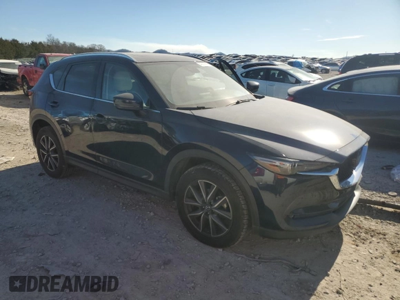 2018 Mazda CX-5 Grand Touring with VIN JM3KFADM4J1341740, listed as a Copart auction lot 46805955 with 99,114 mi miles and Salvage Title. Bid and sale history available at DreamBid. Image 4.