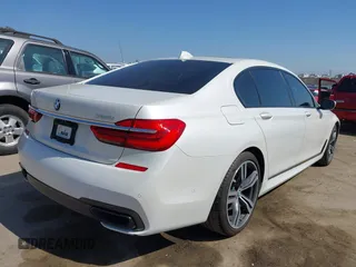2019 BMW 7 Series 750i with VIN WBA7F0C5XKGM25771, listed as a IAAI auction lot 42167614 with 73,692 mi miles. Bid and sale history available at carsss.com. Image 4.