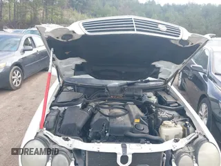 2001 Mercedes-Benz E-Class AWD with VIN WDBJH82J61X057506, listed as a IAAI auction lot 41506666 with 304,332 mi miles. Bid and sale history available at carsss.com. Image 10.