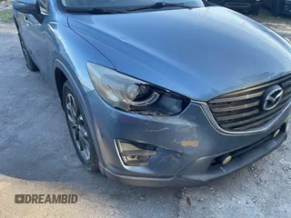 2016 Mazda CX-5 Grand Touring with VIN JM3KE4DY9G0673789, listed as a IAAI auction lot 42196841 with 98,622 mi miles and . Bid and sale history available at DreamBid. Image 6.