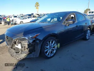 2014 Mazda 3 S Grand Touring with VIN JM1BM1W36E1112033, listed as a IAAI auction lot 41412655 with 115,050 mi miles and . Bid and sale history available at DreamBid. Image 2.