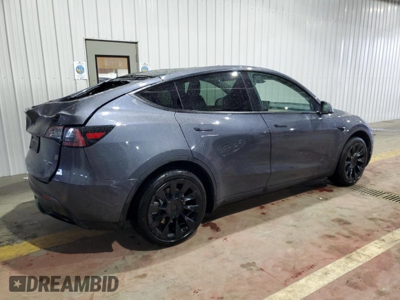 2023 Tesla Model Y Long Range z VIN 7SAYGDEE8PF814874, wystawiony jako Copart lot #56546365 z przebiegiem 20 919 mil mil oraz Szkoda całkowita • Salvage title. Historia ofert i sprzedaży dostępna na DreamBid. Obrazek 3.