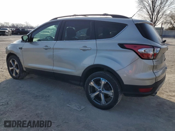 2017 Ford Escape SE with VIN 1FMCU0GD0HUD26729, listed as a Copart auction lot 44824135 with 102,549 mi miles and Salvage Title. Bid and sale history available at carsss.com. Image 2.