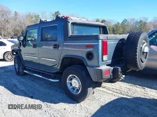 2005 Hummer H2 SUT with VIN 5GRGN22U15H114401, listed as a IAAI auction lot 41268764 with 166,651 mi miles. Bid and sale history available at carsss.com. Image 3.