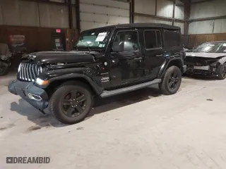 2019 Jeep Wrangler Unlimited Sahara with VIN 1C4HJXEG9KW579682, listed as a IAAI auction lot 41310472 with 74,265 mi miles. Bid and sale history available at carsss.com. Image 2.