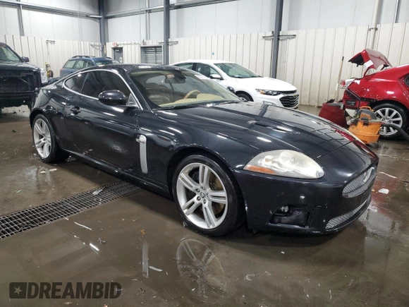 2007 Jaguar XK with VIN SAJWA43C479B18700, listed as a Copart auction lot 83377684 with 143,746 mi miles and Salvage Title. Bid and sale history available at carsss.com. Image 4.