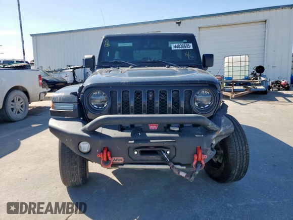 2021 Jeep Wrangler Unlimited Rubicon with VIN 1C4JJXFM9MW565029, listed as a Copart auction lot 44030695 with 76,510 mi miles and Salvage Title. Bid and sale history available at carsss.com. Image 5.