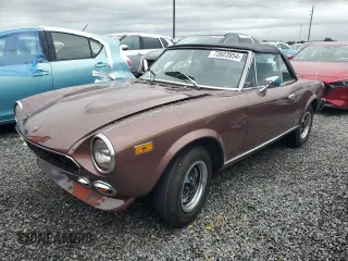 1979 FIAT 124 Spider z VIN 124CS20146682, wystawiony jako Copart lot #73923954 z przebiegiem 83 258 mil mil oraz Szkoda całkowita • Salvage title. Historia ofert i sprzedaży dostępna na DreamBid. Obrazek 1.