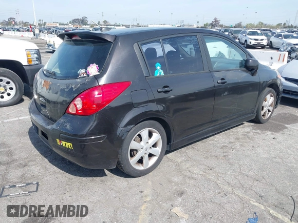 2012 Nissan Versa S with VIN 3N1BC1CP4CK203309, listed as a IAAI auction lot 41614884 with 141,770 mi miles. Bid and sale history available at carsss.com. Image 4.
