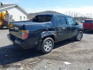 2007 Honda Ridgeline RTL w/Leather with VIN 2HJYK165X7H548322, listed as a IAAI auction lot 41983105 with 152,292 mi miles. Bid and sale history available at carsss.com. Image 4.