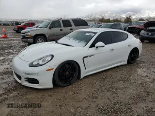 2015 Porsche Panamera S E-Hybrid z VIN WP0AD2A75FL040646, wystawiony jako Copart lot #80579354 z przebiegiem 125 575 mil mil oraz Tytuł czysty. Historia ofert i sprzedaży dostępna na DreamBid. Obrazek 1.
