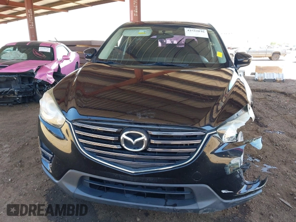 2016 Mazda CX-5 Sport with VIN JM3KE4BY8G0829002, listed as a IAAI auction lot 42553846 with 103,231 mi miles and . Bid and sale history available at DreamBid. Image 13.