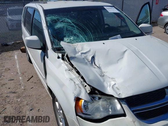 2012 Dodge Grand Caravan SXT with VIN 2C4RDGCGXCR365194, listed as a IAAI auction lot 42058530 with 131,059 mi miles and . Bid and sale history available at DreamBid. Image 6.