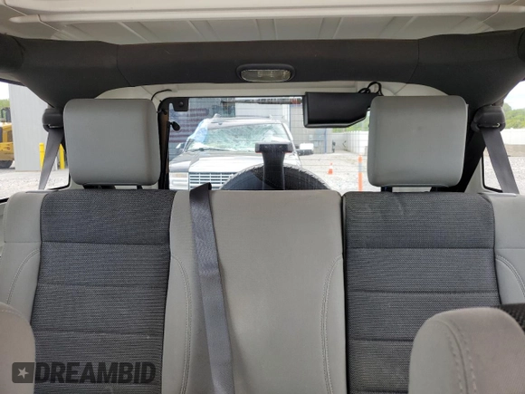 2007 Jeep Wrangler Unlimited X with VIN 1J4GA39117L169245, listed as a Copart auction lot 56731665 with 136,247 mi miles and Salvage title. Bid and sale history available at DreamBid. Image 10.
