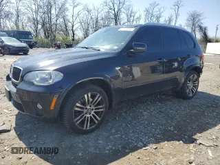 2012 BMW X5 35i z VIN 5UXZV4C55CL990099, wystawiony jako Copart lot #51152075 z przebiegiem 120 764 mil mil oraz Szkoda całkowita • Salvage title. Historia ofert i sprzedaży dostępna na DreamBid. Obrazek 1.