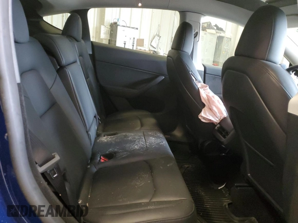 2024 Tesla Model Y Long Range с VIN 7SAYGDEE8RA270862, выставлен на аукционе Copart как лот 58099875 с пробегом 24 856 миль миль и На запчасти • Non repairable. История ставок и продаж доступна на DreamBid. Изображение 11.