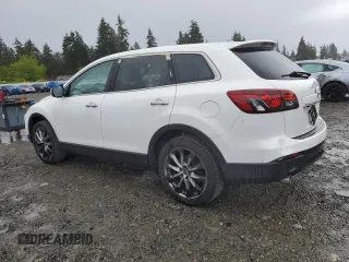 2014 Mazda CX-9 Grand Touring with VIN JM3TB2DA5E0438288, listed as a Copart auction lot 56970705 with 147,526 mi miles and Salvage title. Bid and sale history available at DreamBid. Image 2.