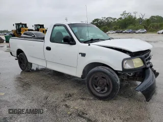 2002 Ford F-150 XL with VIN 1FTRF17W32NB86385, listed as a Copart auction lot 73276754 with 100,817 mi miles and Salvage Title. Bid and sale history available at carsss.com. Image 4.
