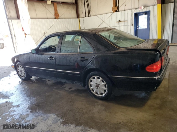 1999 Mercedes-Benz E-Class with VIN WDBJF65H1XA746402, listed as a Copart auction lot 48303385 with 156,461 mi miles and Salvage Title. Bid and sale history available at carsss.com. Image 2.
