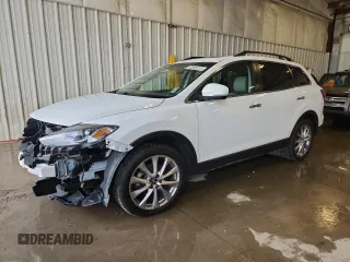 2014 Mazda CX-9 Grand Touring с VIN JM3TB3DA3E0446329, выставлен на аукционе Copart как лот 64068025 с пробегом 90 423 миль миль и Чистый • Clean title. История ставок и продаж доступна на DreamBid. Изображение 1.