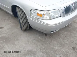 2006 Mercury Grand Marquis GS z VIN 2MEFM74V16X646802, wystawiony jako IAAI lot #42358697 z przebiegiem 169 321 mil mil oraz . Historia ofert i sprzedaży dostępna na DreamBid. Obrazek 6.