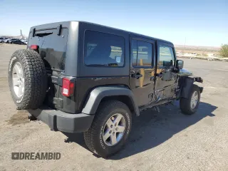 2014 Jeep Wrangler Unlimited Sport with VIN 1C4BJWDG8EL207287, listed as a Copart auction lot 49522335 with 67,472 mi miles and Salvage Title. Bid and sale history available at carsss.com. Image 3.