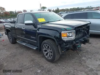 2014 GMC Sierra 1500 SLT with VIN 1GTV2VEJXEZ389280, listed as a IAAI auction lot 41370436 with 124,311 mi miles. Bid and sale history available at carsss.com. Image 1.