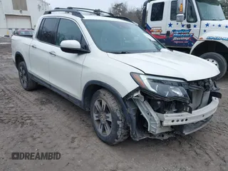 2019 Honda Ridgeline RTL-E with VIN 5FPYK3F77KB007879, listed as a IAAI auction lot 41697569 with 80,215 mi miles and . Bid and sale history available at DreamBid. Image 1.