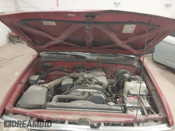 1995 Toyota T100 DX with VIN JT4VD12E0S0013715, listed as a IAAI auction lot 42140145 with 276,371 mi miles. Bid and sale history available at carsss.com. Image 10.
