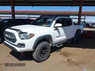 2016 Toyota Tacoma SR with VIN 5TFCZ5ANXGX028464, listed as a IAAI auction lot 41834385 with 124,407 mi miles and . Bid and sale history available at DreamBid. Image 16.