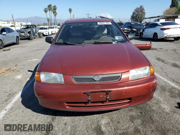 1998 Mazda Protege DX z VIN JM1BC1411W0198007, wystawiony jako Copart lot #46941185 z przebiegiem 101 696 mil mil oraz Szkoda całkowita • Salvage title. Historia ofert i sprzedaży dostępna na DreamBid. Obrazek 5.