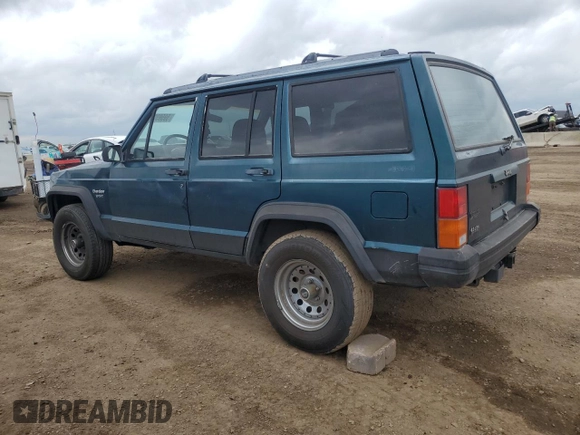1996 Jeep Cherokee Sport with VIN 1J4FJ68S3TL251074, listed as a Copart auction lot 59593955 with 181,482 mi miles and Salvage title. Bid and sale history available at DreamBid. Image 2.