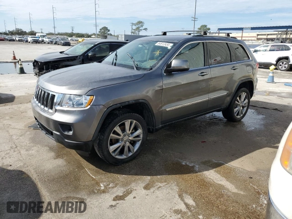 2012 Jeep Grand Cherokee Laredo with VIN 1C4RJEAG1CC306950, listed as a Copart auction lot 84912434 with 128,659 mi miles and Salvage Title. Bid and sale history available at carsss.com. Image 1.