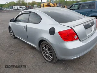 2005 Scion tC with VIN JTKDE177050032815, listed as a IAAI auction lot 42123702 with 228,973 mi miles. Bid and sale history available at carsss.com. Image 3.