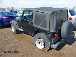 2002 Jeep Wrangler X with VIN 1J4FA39S52P770664, listed as a IAAI auction lot 41661580 with 122,445 mi miles. Bid and sale history available at carsss.com. Image 3.