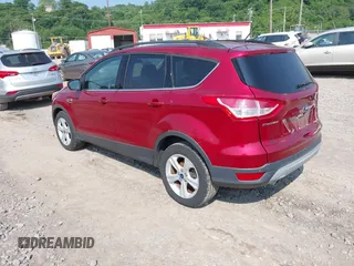 2014 Ford Escape SE z VIN 1FMCU9GX9EUC56559, wystawiony jako IAAI lot #42386594 z przebiegiem 98 722 mil mil oraz . Historia ofert i sprzedaży dostępna na DreamBid. Obrazek 3.