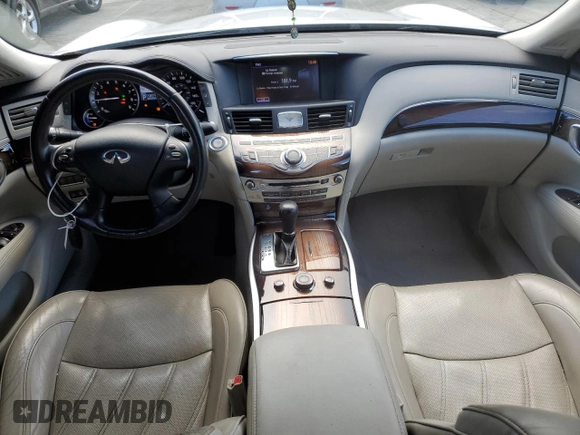 2012 Infiniti M Hybrid with VIN JN1EY1AP3CM910631, listed as a Copart auction lot 49162705 with 128,771 mi miles and Salvage title. Bid and sale history available at DreamBid. Image 8.