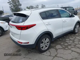 2018 Kia Sportage LX with VIN KNDPM3AC1J7413227, listed as a IAAI auction lot 42188566 with 77,897 mi miles and . Bid and sale history available at carsss.com. Image 4.