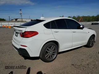 2018 BMW X4 M40i with VIN 5UXXW7C52J0W64443, listed as a Copart auction lot 53877525 with 49,634 mi miles and Salvage title. Bid and sale history available at DreamBid. Image 3.