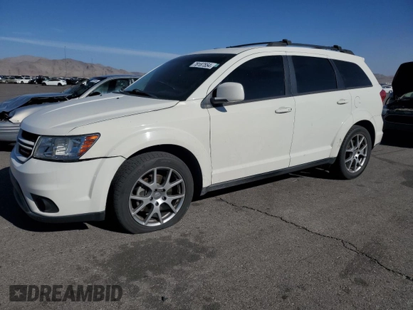 2013 Dodge Journey R/T with VIN 3C4PDCEG3DT659001, listed as a Copart auction lot 78187554 with 128,052 mi miles and Salvage title. Bid and sale history available at DreamBid. Image 1.