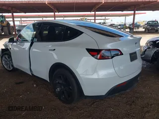 2021 Tesla Model Y Long Range with VIN 5YJYGAEE9MF254113, listed as a IAAI auction lot 42045256 with Not Provided miles. Bid and sale history available at carsss.com. Image 3.