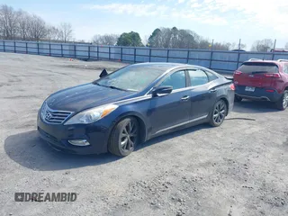 2013 Hyundai Azera with VIN KMHFH4JG6DA233205, listed as a IAAI auction lot 41643389 with 200,842 mi miles and . Bid and sale history available at carsss.com. Image 2.