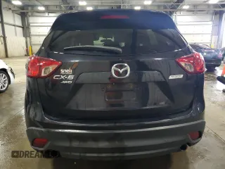 2014 Mazda CX-5 Grand Touring with VIN JM3KE4DY0E0322606, listed as a Copart auction lot 54381815 with 216,022 mi miles and Salvage Title. Bid and sale history available at DreamBid. Image 6.