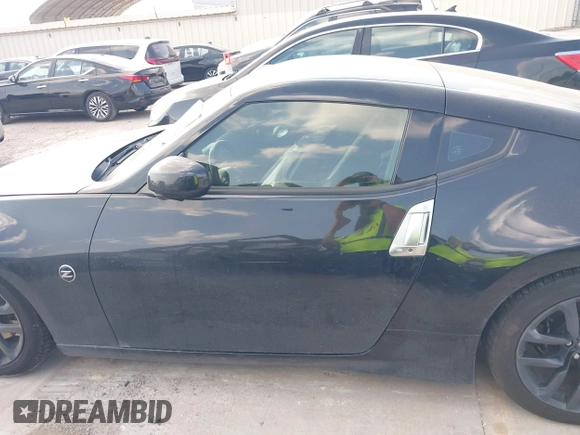2015 Nissan 370Z z VIN JN1AZ4EH2FM442556, wystawiony jako IAAI lot #41956287 z przebiegiem 128 769 mil mil oraz . Historia ofert i sprzedaży dostępna na DreamBid. Obrazek 15.
