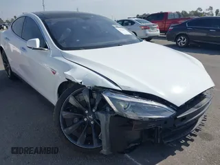 2014 Tesla Model S 60 with VIN 5YJSA1H15EFP46980, listed as a IAAI auction lot 41583672 with 61,080 mi miles and . Bid and sale history available at DreamBid. Image 1.