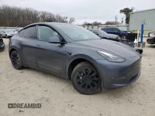 2022 Tesla Model Y Long Range with VIN 7SAYGAEE6NF523835, listed as a Copart auction lot 47874565 with Not Provided miles and Salvage Title. Bid and sale history available at DreamBid. Image 4.