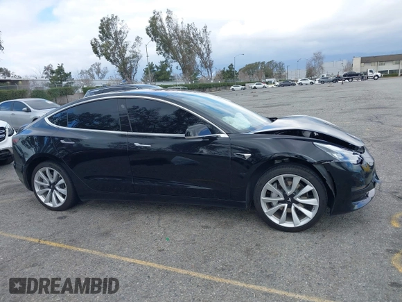 2018 Tesla Model 3 Long Range Battery with VIN 5YJ3E1EA9JF009384, listed as a IAAI auction lot 41544624 with 66,896 mi miles and . Bid and sale history available at DreamBid. Image 13.